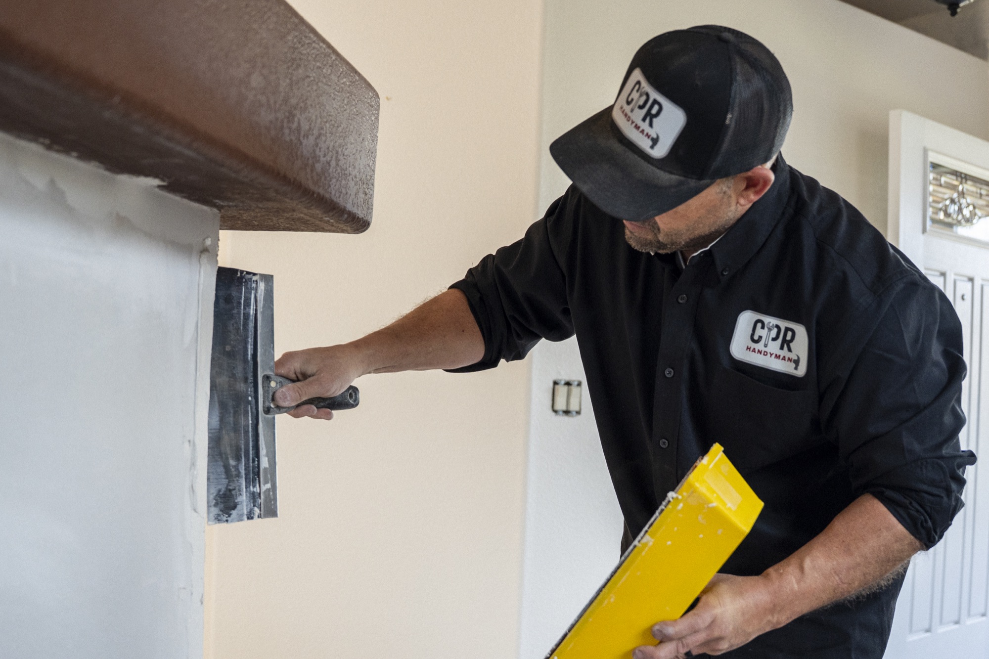 Mike from CPR Handyman finishing an interior wall Mike from CPR Handyman finishing an interior wall