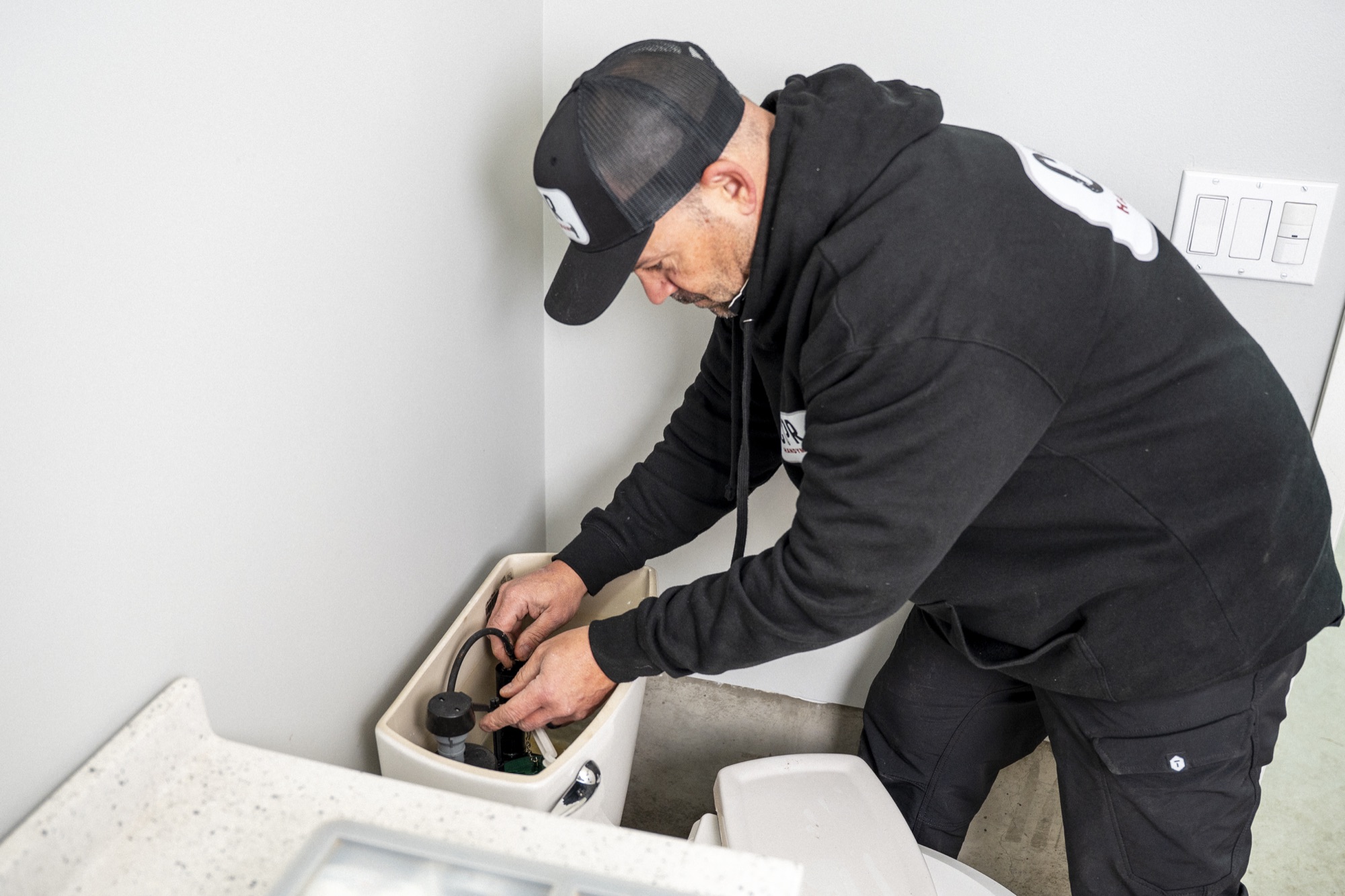 Mike from CPR Handyman repairing a toilet