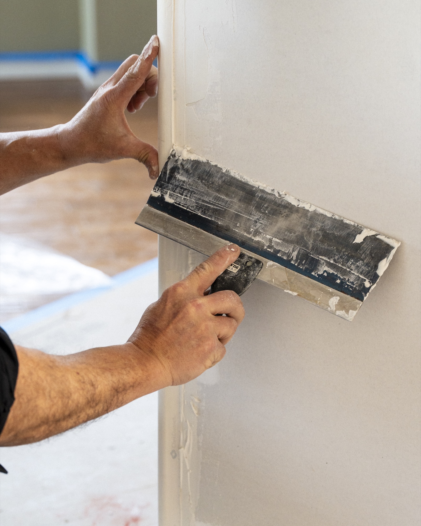 Close-up of CPR Handyman finishing drywall Close-up of CPR Handyman finishing drywall