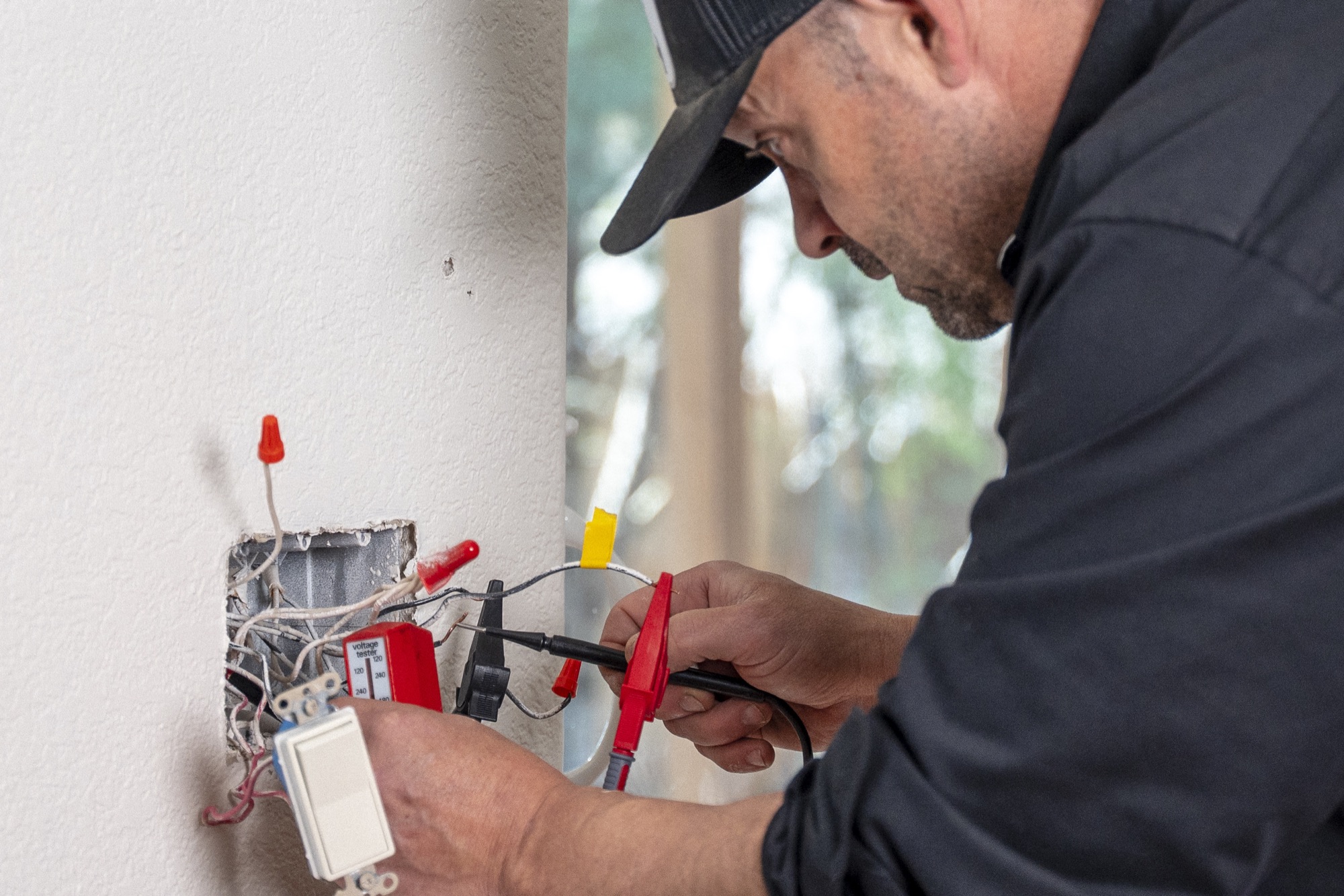 Mike from CPR Handyman testing an electrical connection