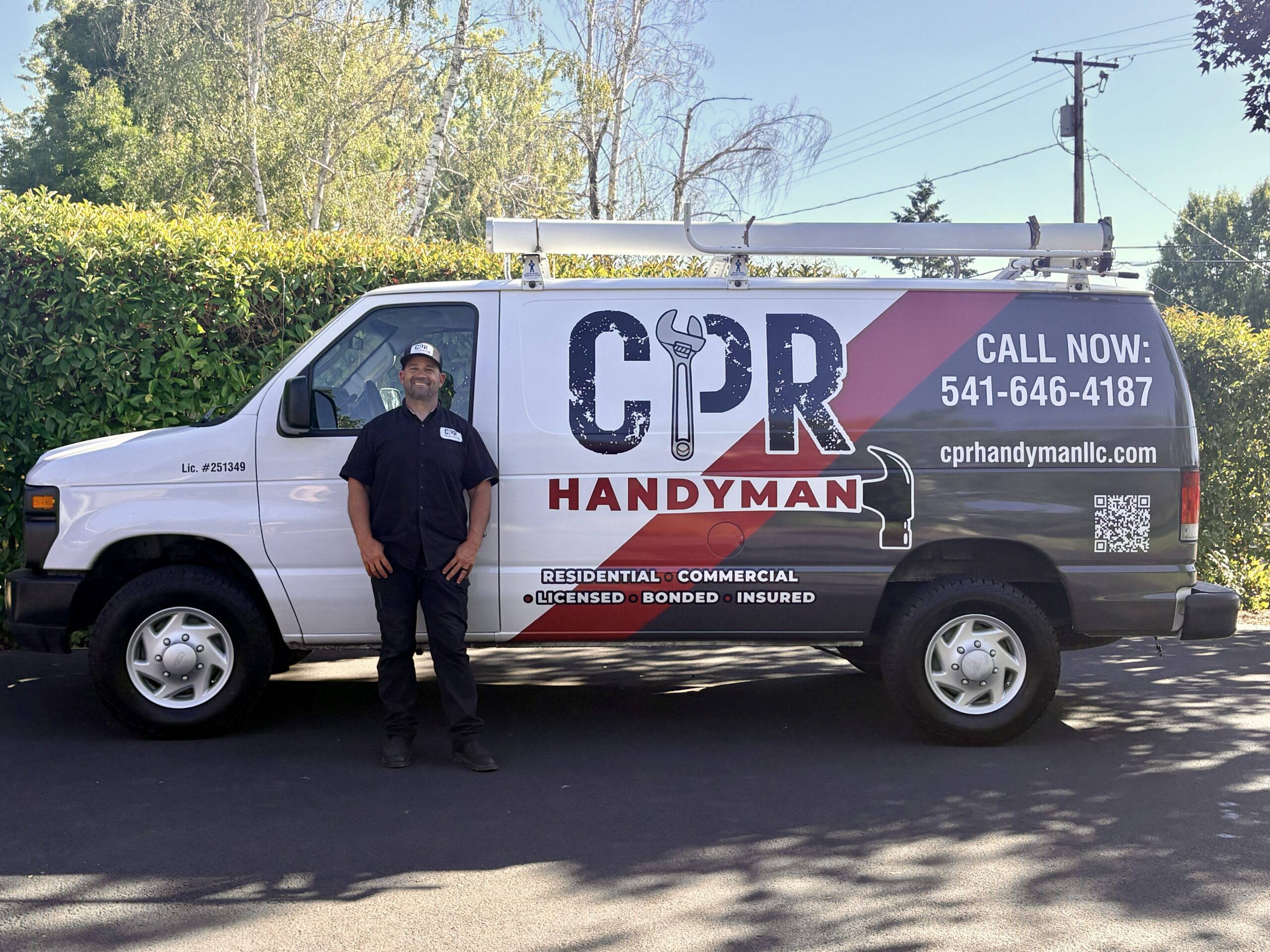 Mike Longo standing beside the CPR Handyman service van